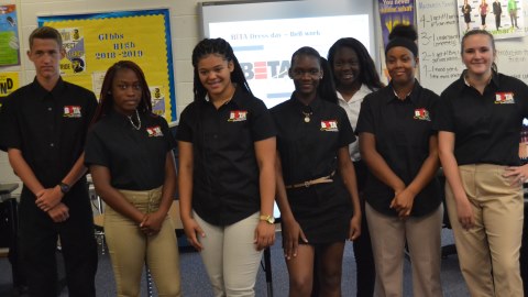 Seven BETA students pose for a group picture 